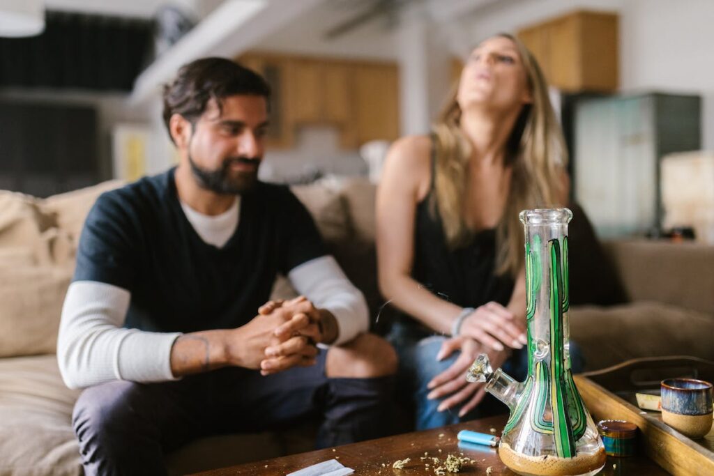 Two people enjoying a smoke together